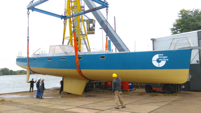 a side view of one of our new Sea Ranger Service ships. The ship is blue and yellow.